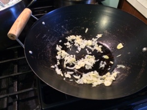 onions and garlic in wok